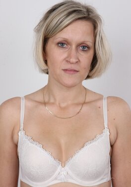 Blonde mature woman in jeans and white lingerie doesn't protect her privacy