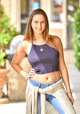 During walk via city streets Ashley Adams loves to show her natural curves