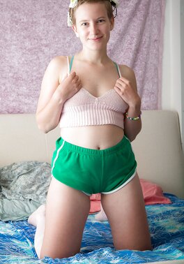 Ugly short-haired teen Zina peels shorts off to spread hairy pussy lips