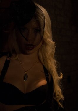 Ravishing vampire sneaks in darkened cellar to show juicy boobs near wall