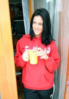 Sportsgirl in red hoody has a tradition of masturbation after morning workout