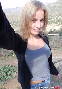 Cock-hungry blonde chick rubs pussy while filming herself in the mountains