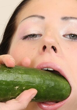 Girl enjoying a huge cucumber in her overflowing pussy hole