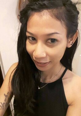 Asian brunette with sexy tattoos snapping a few hot pictures