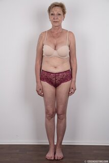 Mature porn model with tattooed shoulder advertises natural twins ...