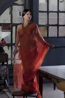 Diva in a transparent red sari fails to hide her big melons with ...