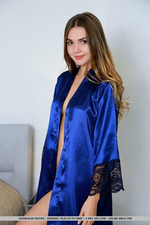18-year-old cutie demonstrates the gentle beauty hidden under silk robe