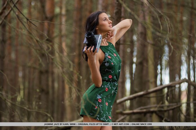 Long-legged Ukrainian bombshell poses naked in the mysterious coniferous forest