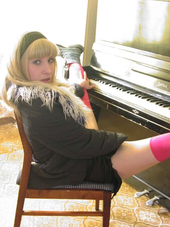 Instead of playing on piano slender blonde decides to perform striptease