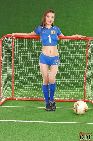Oriental babe has body painted like a football uniform for topical photoshoot