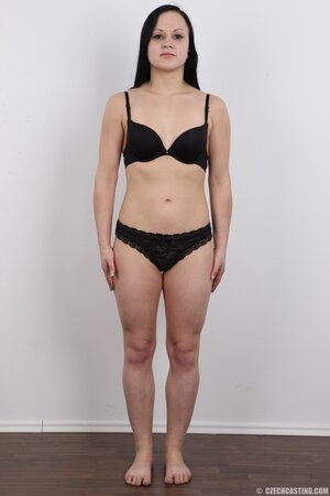 Girl with eyes the bleakest black and the same underwear happy with nakedness