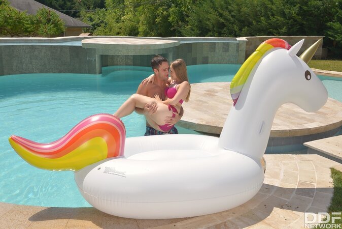Female is lying on inflatable unicorn in pool and then makes man sneak into pussy