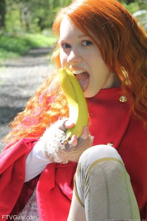 Little Red Riding Hood lost in the woods using banana to masturbate vagina