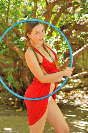 Babe has to work hard with hula hoop to burn fat and gets excited outdoors