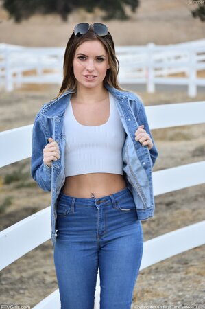 Model in blue jeans and jacket loves flashing her small boobs on camera