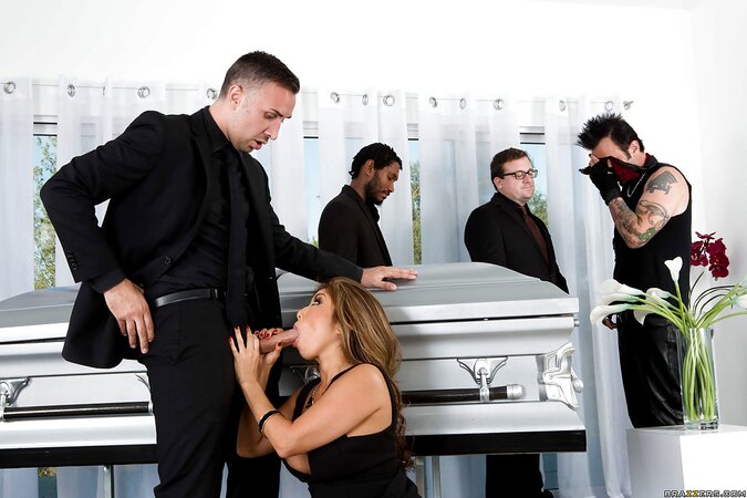 Great MILF surprises boyfriend giving him a blowjob in a coffin at the wake