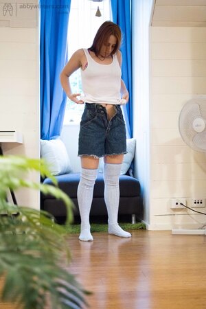 Girl in high socks puts on clothes without knowing that a roommate spies on her