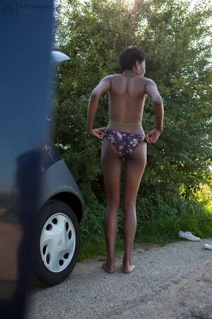 Leggy African girl with curly hair gets dressed after quick sex in the car