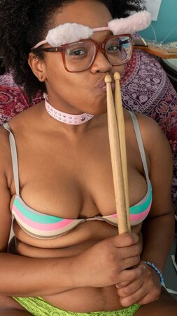 Fuzzy-haired black nerd with hairy vagina improves drumming skills being naked