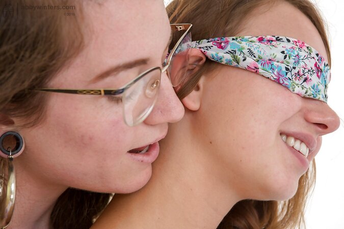 Two teen lesbians with pigtails take off their panties and kiss each other