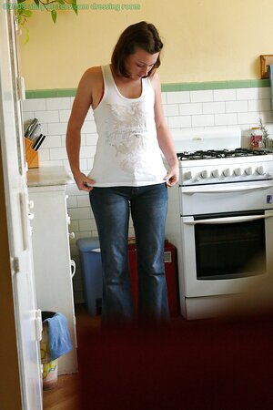 Whorey gets dressed in the kitchen being filmed on a hidden camera