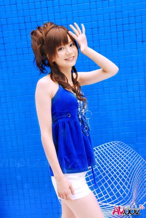 Skinny Japanese teen poses on cam somewhere in private swimming pool