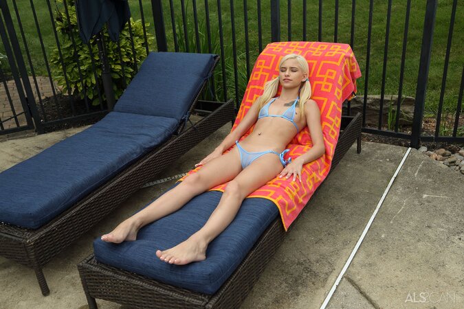 Skinny blonde bimbo can't tan this cloudy day so decides to fist herself