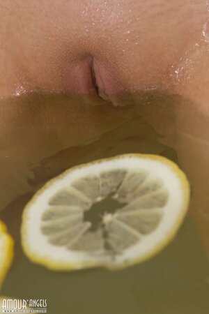 Slut takes a bath with lemons specially to expose her small tits and pussy