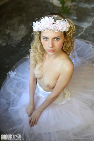 Before wedding ceremony enticing blonde performs strip show in abandoned chapel