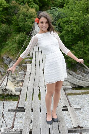 Adorable gal Nensi not shy to pose without clothes on a suspension bridge