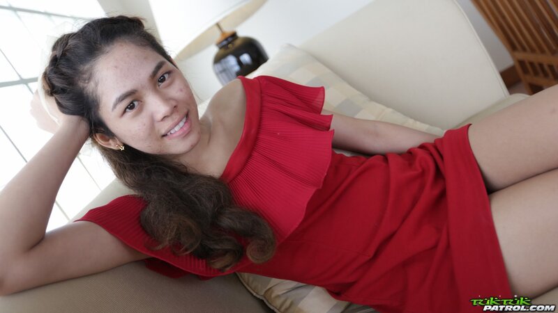 Thai slut in a red dress never stops smiling even in the backseat of a taxi