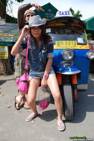 Joyful exotic teen agrees to pose with mature guy near auto rickshaw