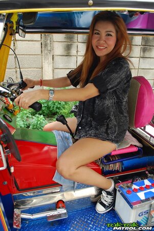 Clothed Thai girl with a cute face and red hair can brag about wonderful legs
