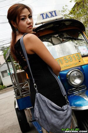 Eccentric tourist coaxes modest Asian teen to pose outdoors near rickshaw