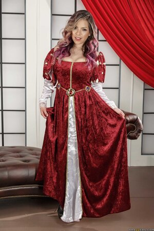 Pornstar with dyed hair takes her Victorian dress off advertise her round knockers