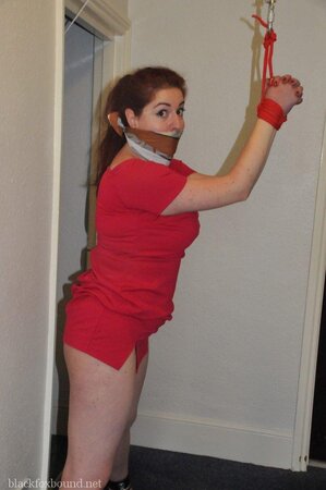 Woman in red dress is restrained by husband for being a bad wife and sex partner