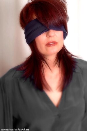 Compilation of porn pics of a pornstar with red hair being hogtied and blindfolded