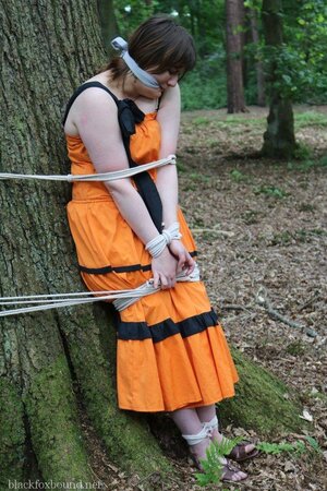 Helpless housewife is captured by lover and tied up to tree in public park