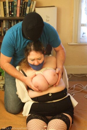 Female with huge jugs is tied up but masked man wants just to touch her hooters