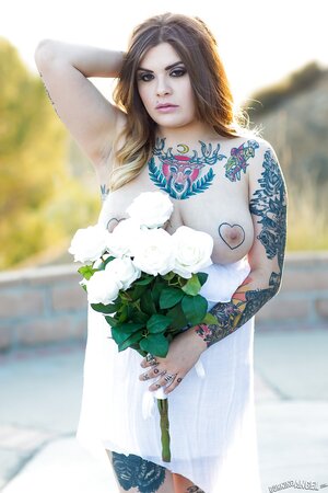 Colleen in white has a tattooed body including nipples to expose outdoors