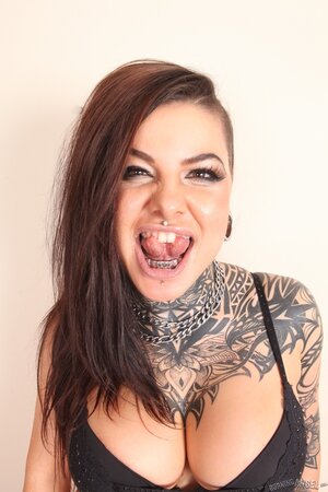 Tattooed student with a forked tongue adores exposing her different body