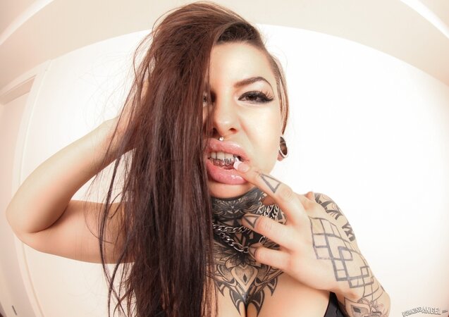 Tattooed student with a forked tongue adores exposing her different body