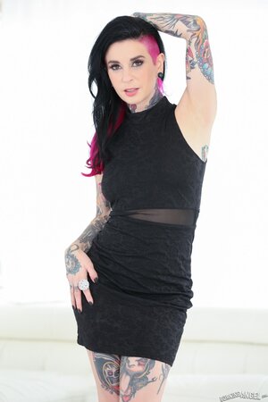 Emo MILF poses in a black dress and then quickly takes it off to surprise the fans