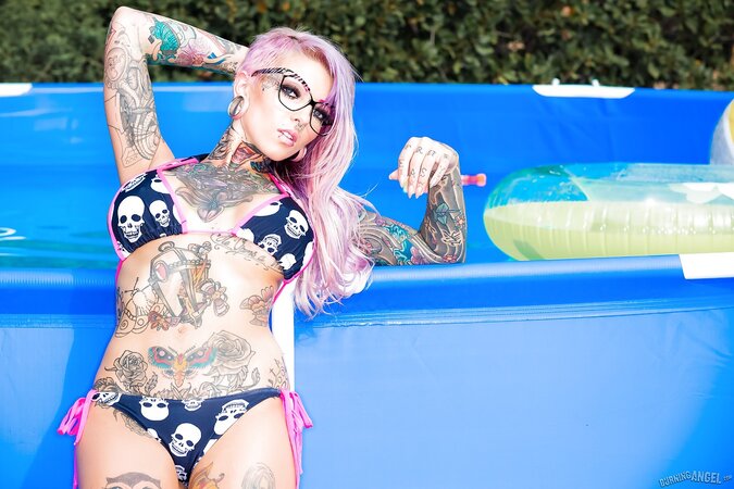 Purple-haired alt chick has own pool so she easily can swim naked there