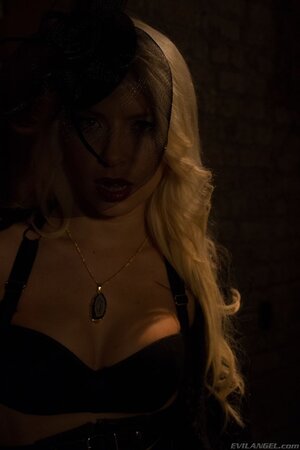 Ravishing vampire sneaks in darkened cellar to show juicy boobs near wall