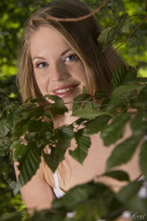 Outstanding girl feels unity with nature by taking off her lingerie in the forest