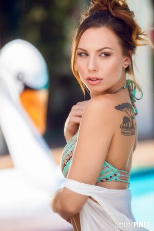 Girl uses swan pool float not for swimming only but also for masturbation