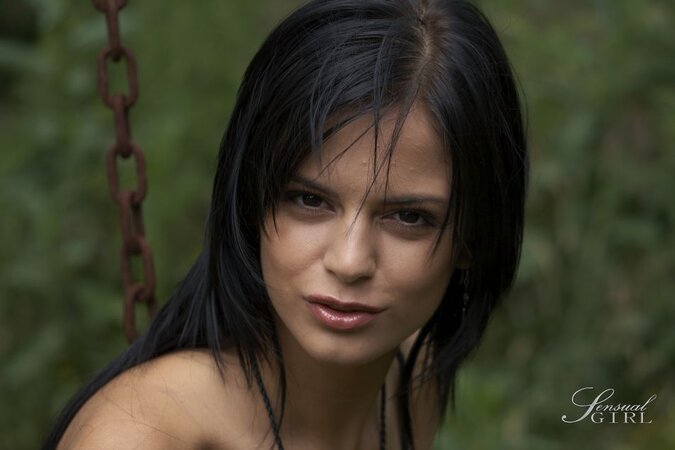 Dark-haired girl from Romania takes part in naked photo session outdoors
