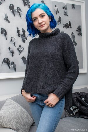 Goth girl with blue hair willingly strips revealing her nice boobs for the camera