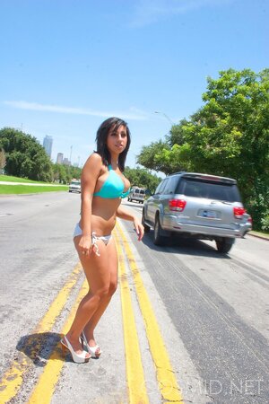 Chubby whore poses in bikini impressing drivers with her curves on the  busy road